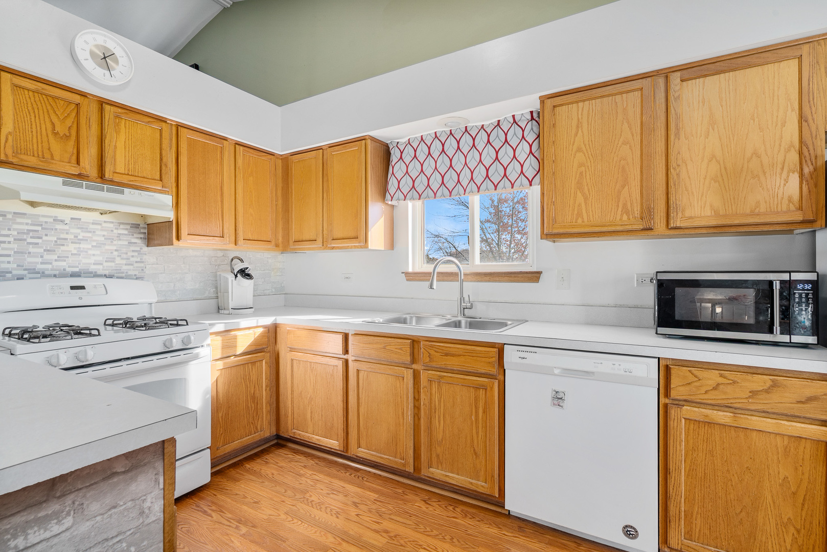 5221 West Mulberry Lane Monee, IL 60449 - Photo 6 of 32 a kitchen with a sink stove and cabinets