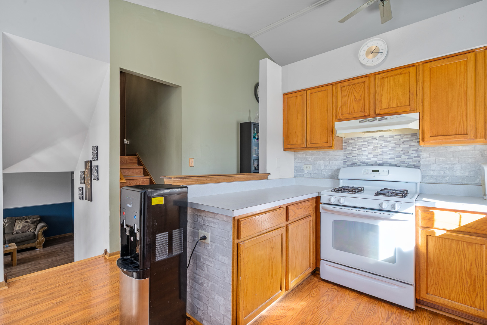 5221 West Mulberry Lane Monee, IL 60449 - Photo 7 of 32 a kitchen with a stove and a microwave