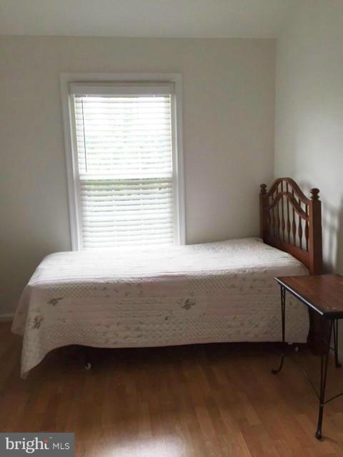 331 Davis Avenue Southwest Leesburg, VA 20175 - Photo 18 of 29 a bedroom with a bed and a window