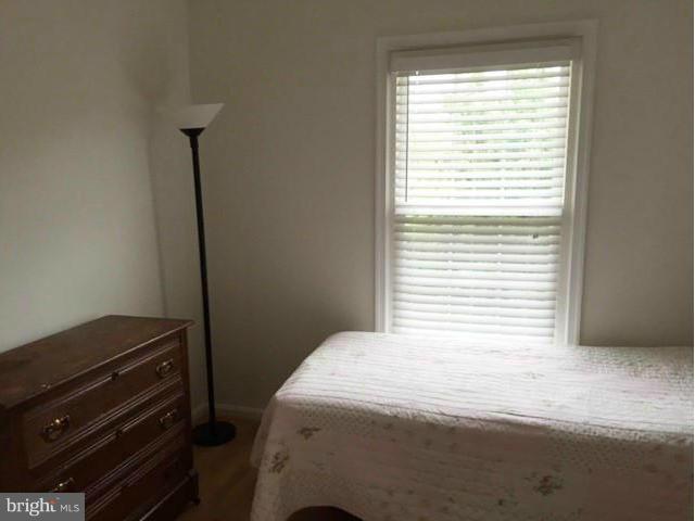 331 Davis Avenue Southwest Leesburg, VA 20175 - Photo 19 of 29 a bedroom with a bed and a window