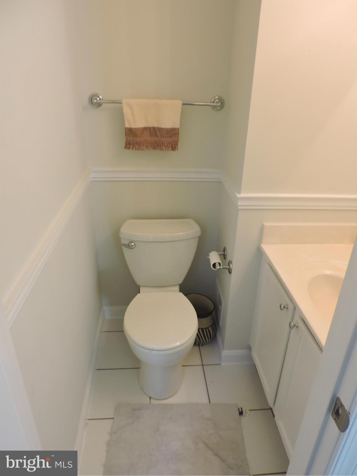 331 Davis Avenue Southwest Leesburg, VA 20175 - Photo 3 of 29 a bathroom with a toilet and a mirror