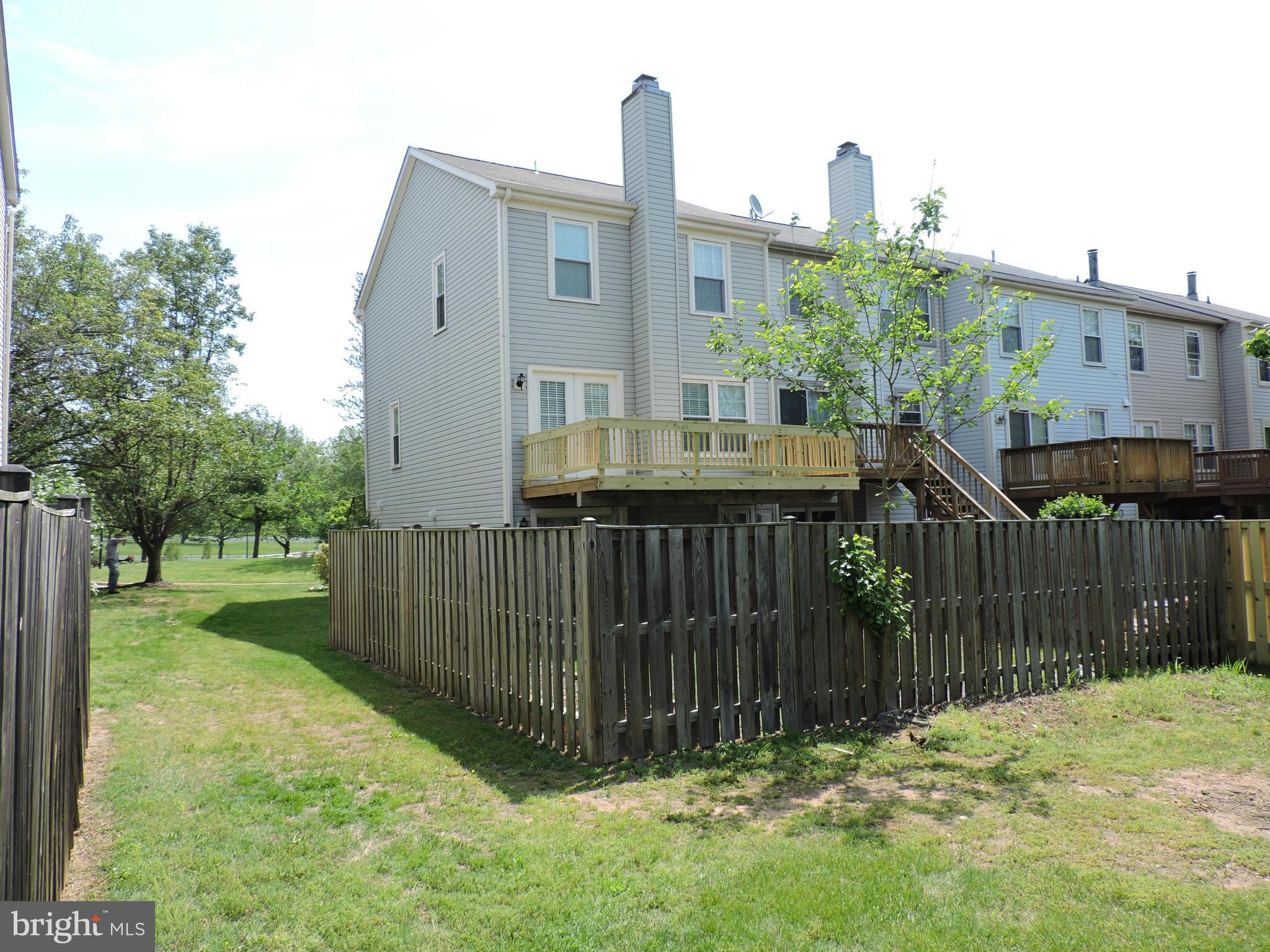 331 Davis Avenue Southwest Leesburg, VA 20175 - Photo 26 of 29 a view of a house with a wooden fence