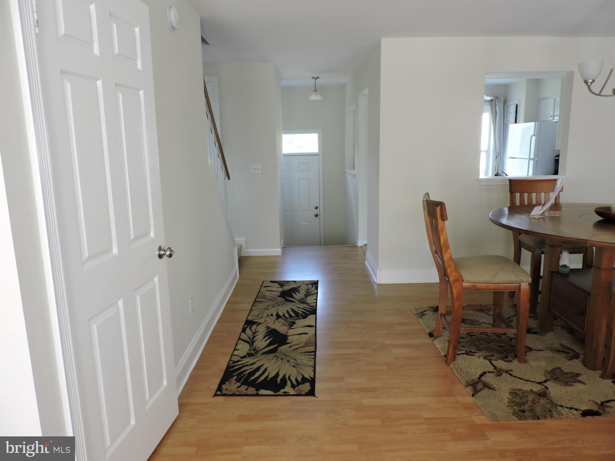331 Davis Avenue Southwest Leesburg, VA 20175 - Photo 8 of 29 a hallway with a dining table and chairs