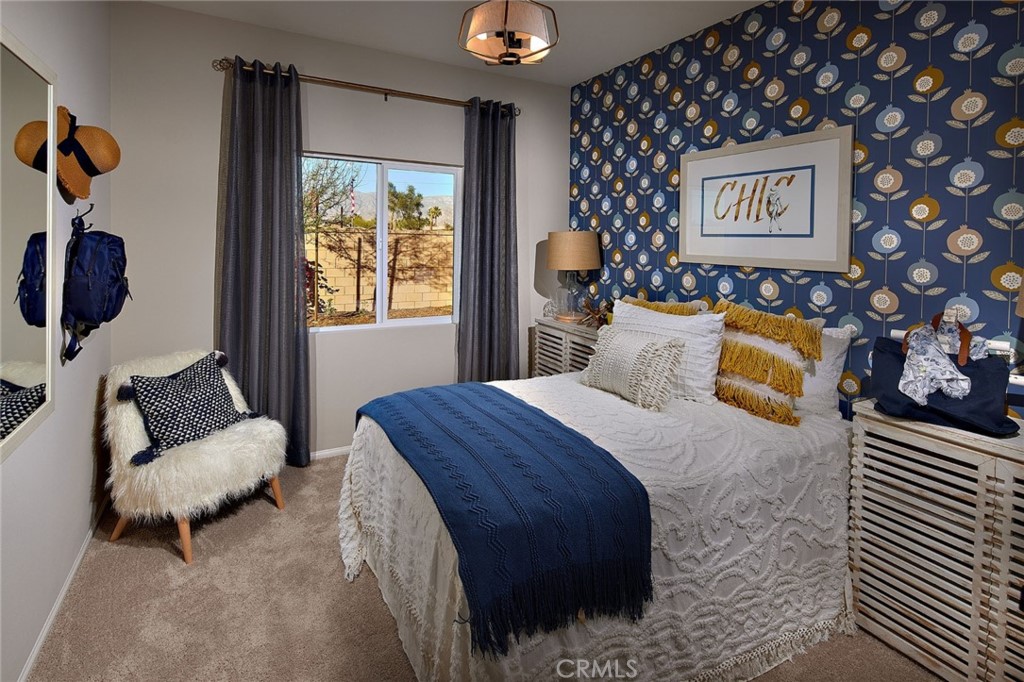 44376 Beringer Drive Indio, CA 92203 - Photo 11 of 17 a bedroom with a bed and a couch