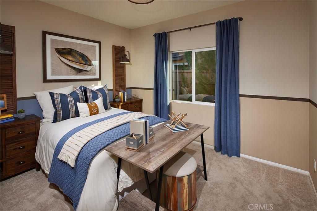 44376 Beringer Drive Indio, CA 92203 - Photo 13 of 17 a bed sitting in a bedroom next to a window