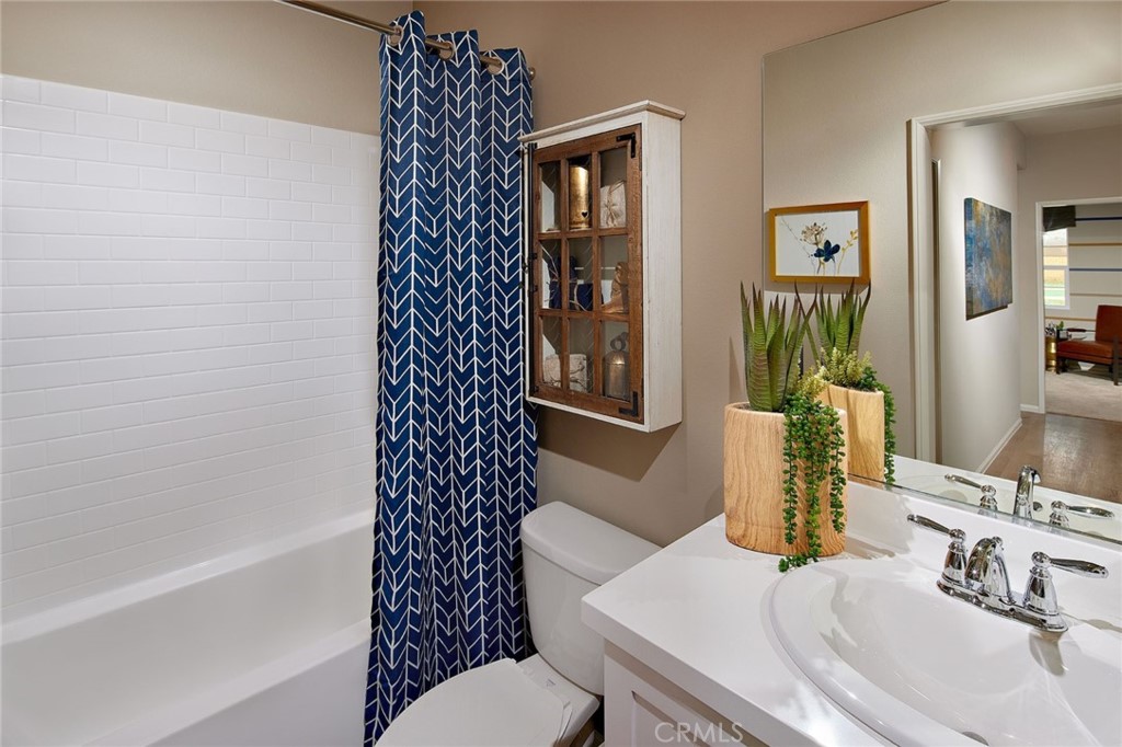 44376 Beringer Drive Indio, CA 92203 - Photo 15 of 17 a bathroom with a granite countertop sink mirror vanity and toilet
