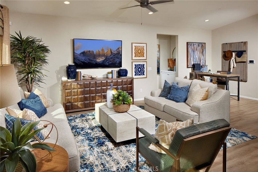 44376 Beringer Drive Indio, CA 92203 - Photo 2 of 17 a living room with fireplace furniture and a potted plant