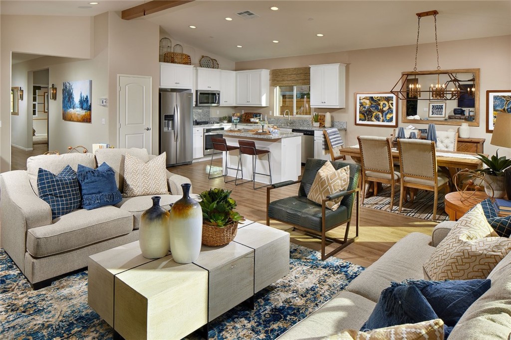 44376 Beringer Drive Indio, CA 92203 - Photo 4 of 17 a living room with furniture kitchen view and a chandelier