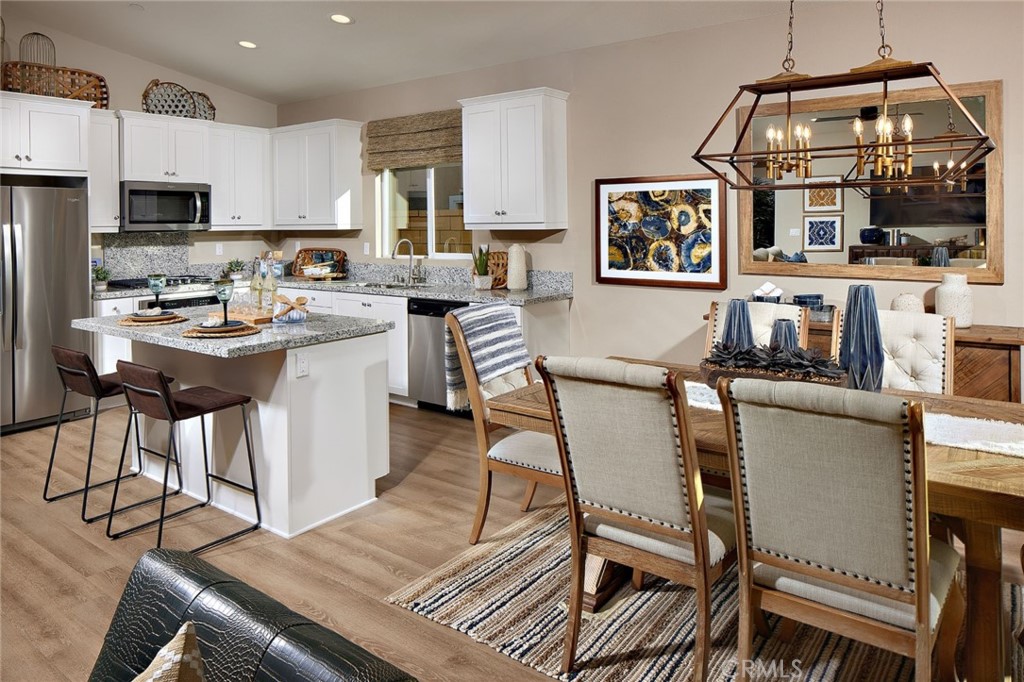 44376 Beringer Drive Indio, CA 92203 - Photo 8 of 17 a view of a dining room with furniture and a kitchen