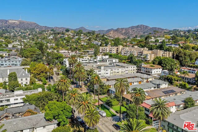 a view of a city with mountains in the background