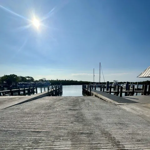 a front view of a building with potted plants