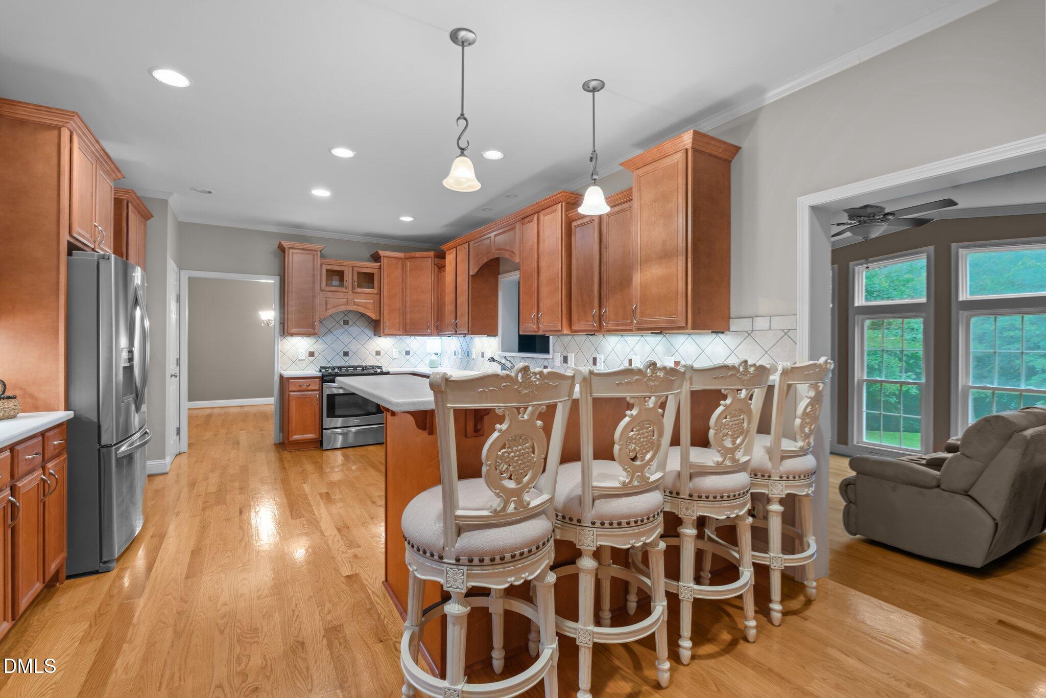 431 Patterson Ridge Lane Sanford, NC 27330 - Photo 3 of 29 a dinning room and kitchen with a large window