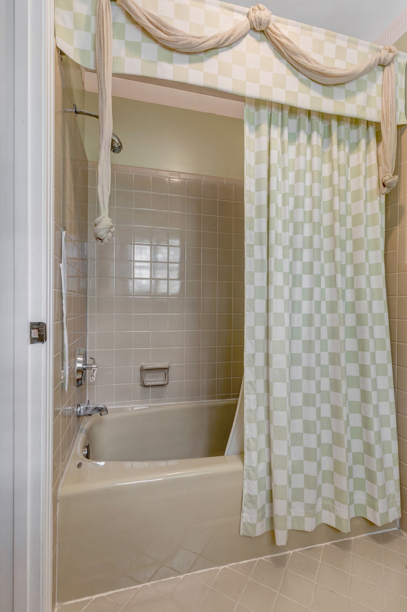 429 Nesbitt Lane Madison, TN 37115 - Photo 29 of 44 a bathroom with a shower curtain and a bathtub