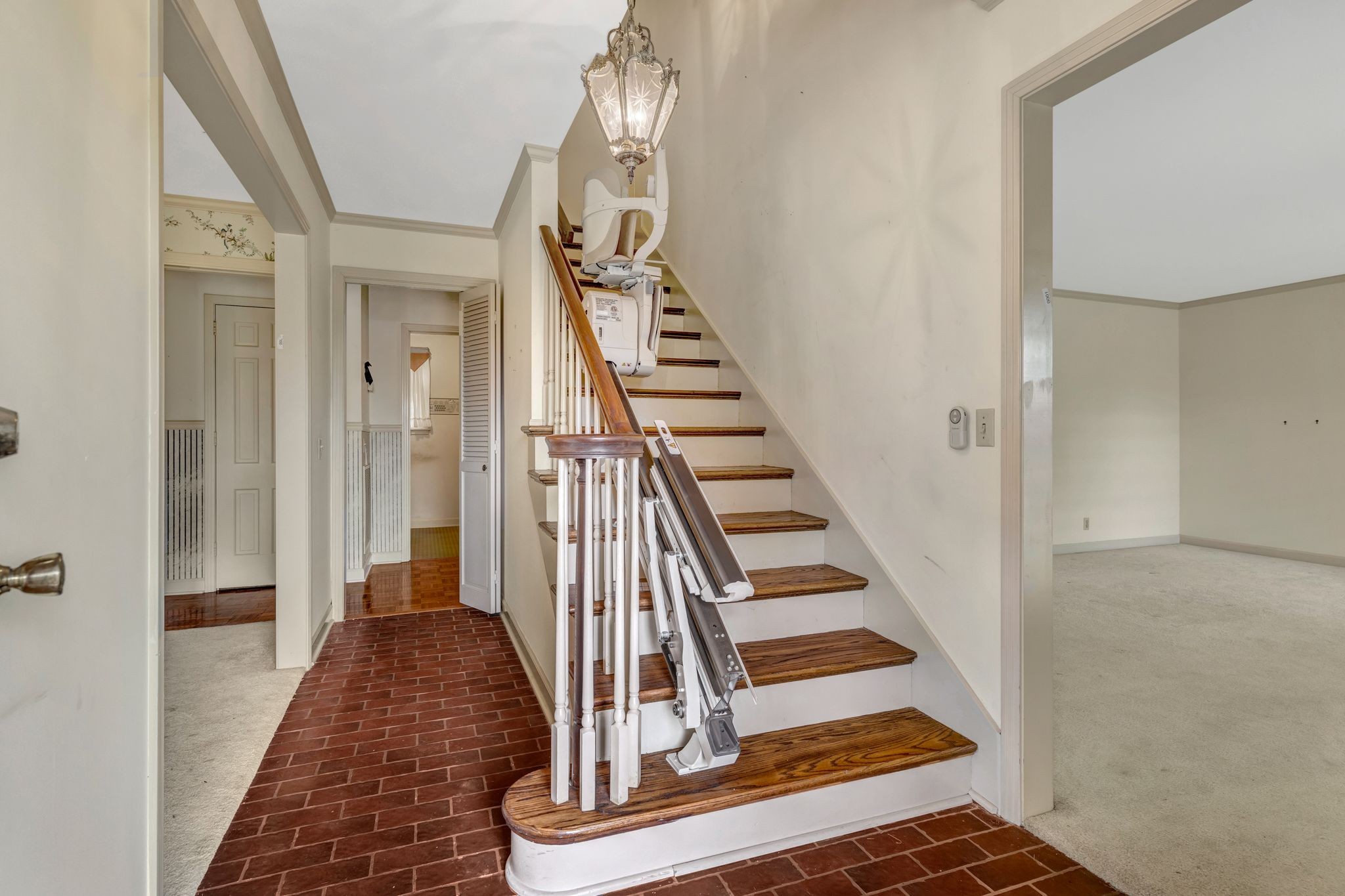 429 Nesbitt Lane Madison, TN 37115 - Photo 7 of 44 a view of a hallway with wooden floor and staircase