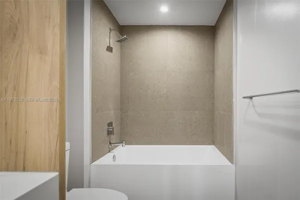 a close view of two sink and a mirror