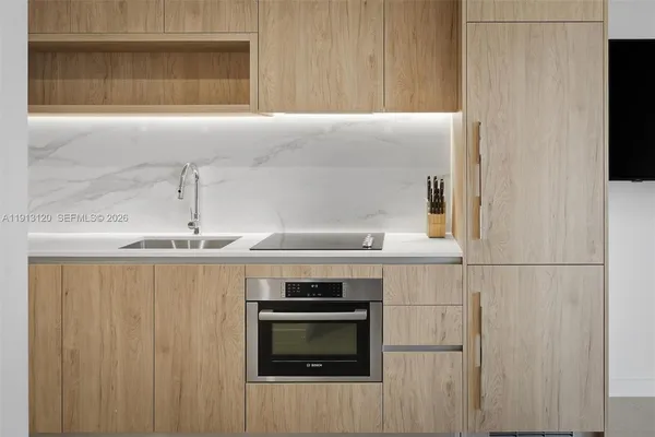 a kitchen with a stove and a microwave