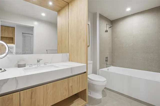 a view of a room with a window and wooden floor