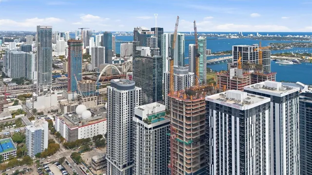a kitchen with stainless steel appliances granite countertop a sink and a microwave