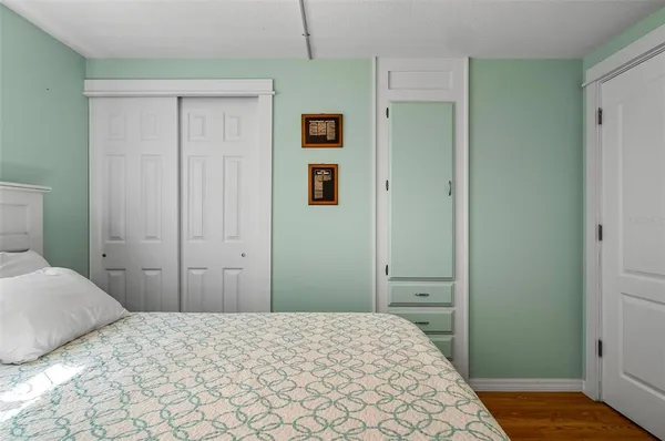 a kitchen with stainless steel appliances granite countertop a refrigerator a stove a sink and a microwave