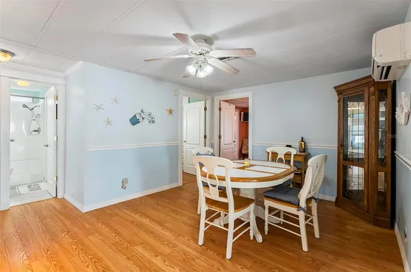 a kitchen with stainless steel appliances granite countertop a refrigerator a stove top oven a sink and dishwasher