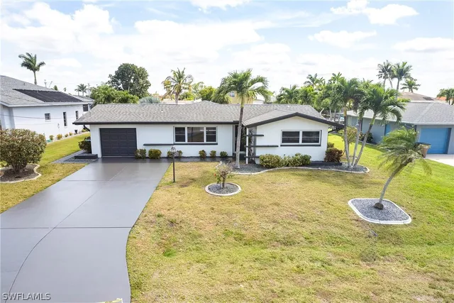 a view of a house with swimming pool and porch
