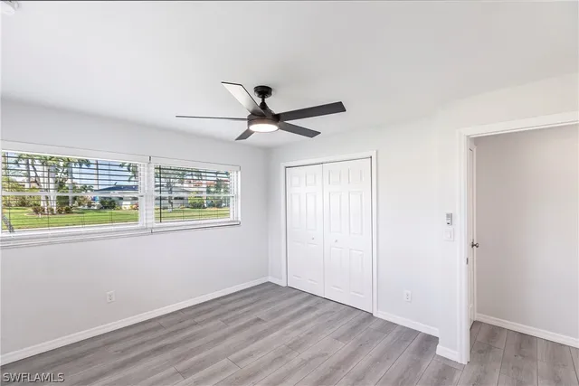 a view of livingroom with hardwood floor and ceiling fan