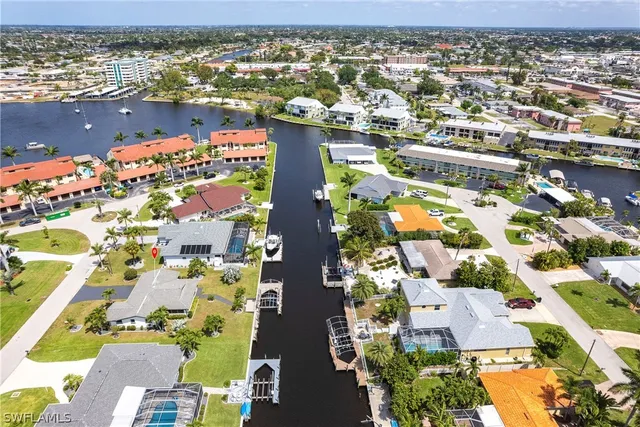 an aerial view of residential building and lake