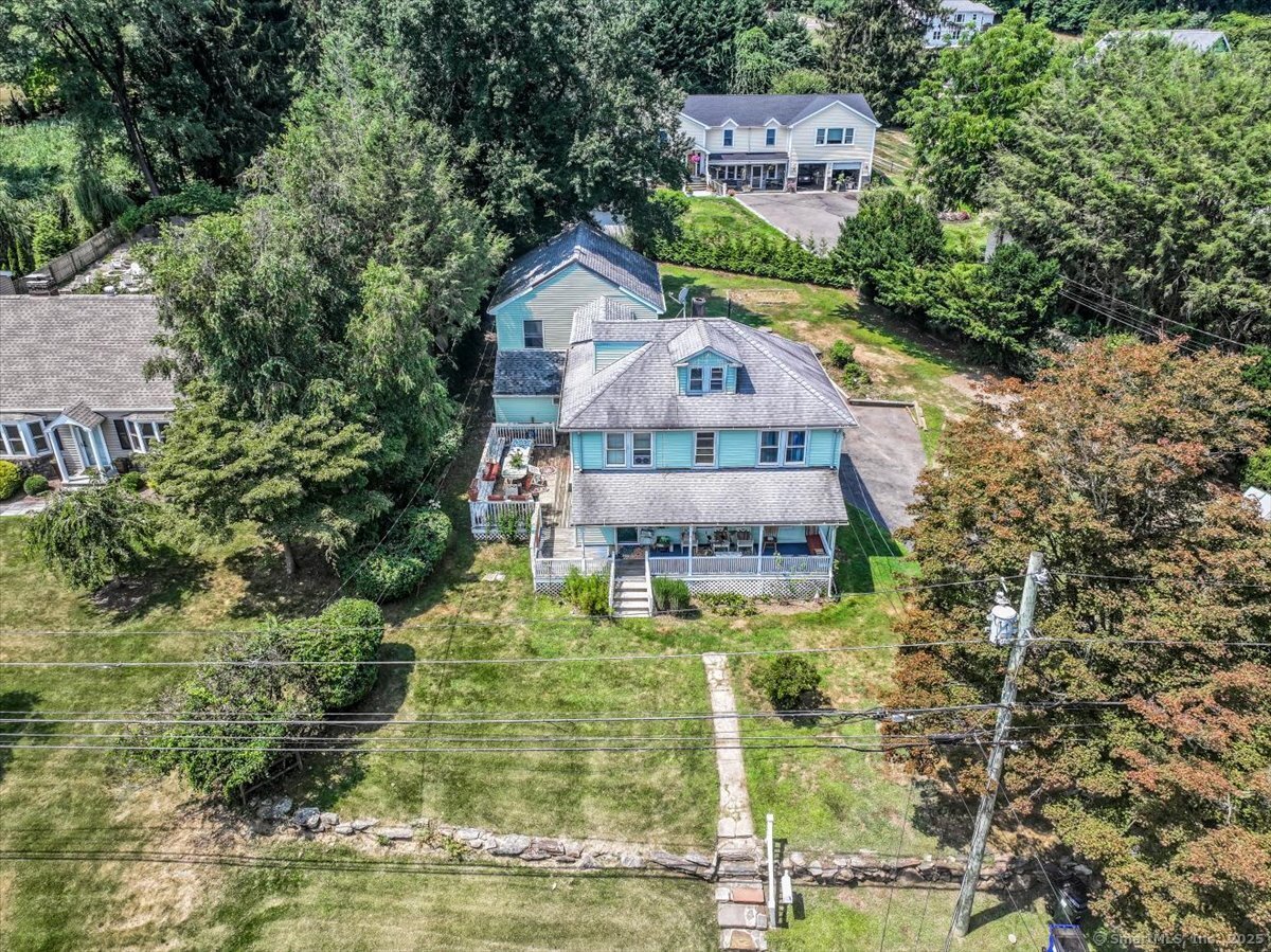 647 Bronson Road Fairfield, CT 06890 - Photo 2 of 10 a view of a house with a yard