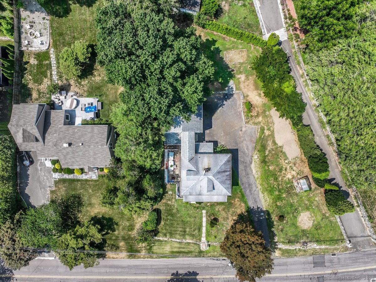 647 Bronson Road Fairfield, CT 06890 - Photo 7 of 10 an aerial view of a house with outdoor space and street view