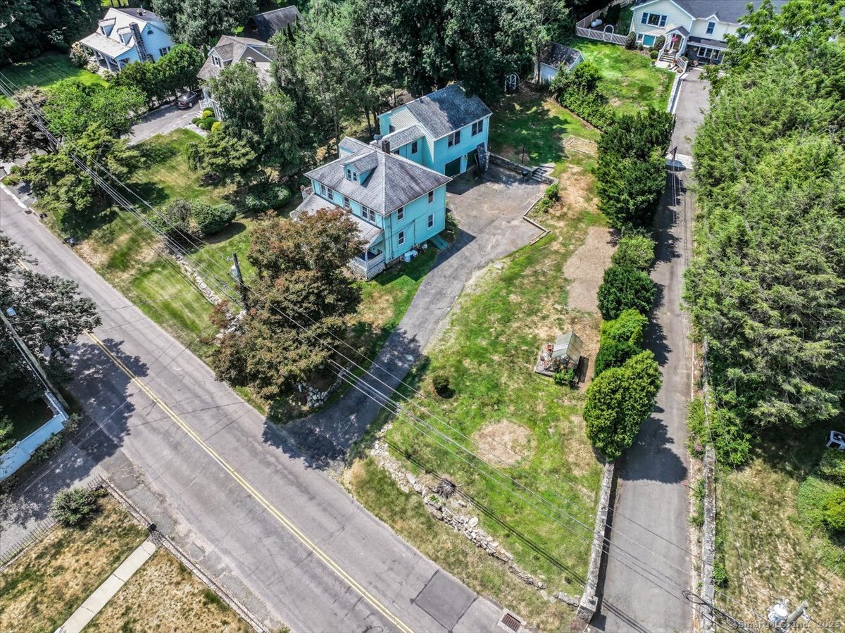 647 Bronson Road Fairfield, CT 06890 - Photo 8 of 10 an aerial view of residential house with outdoor space and street view