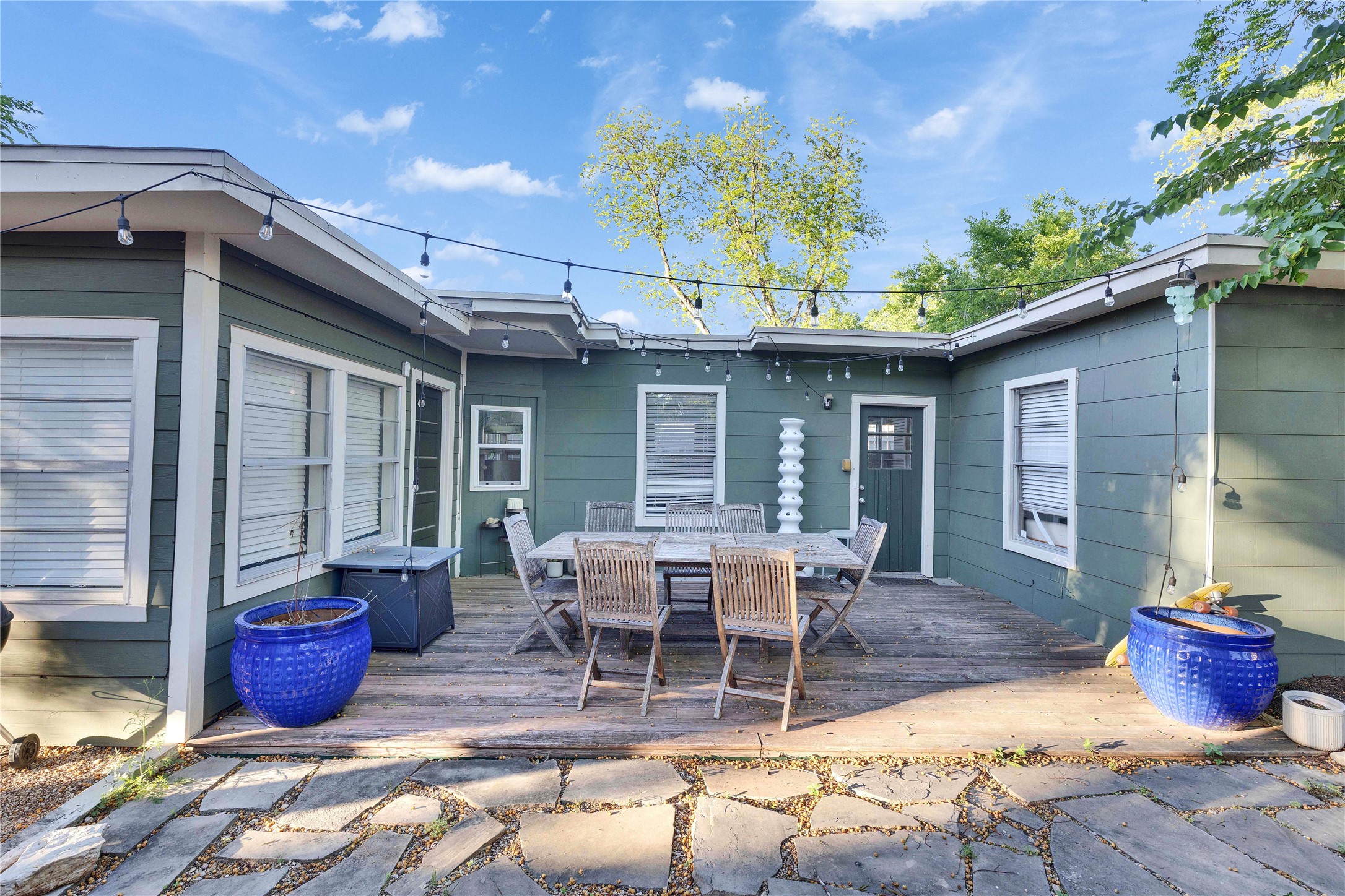 4607 Evans Avenue, Unit B Austin, TX 78751 - Photo 25 of 34 Expansive wood-finish deck bordered by a flagstone patio