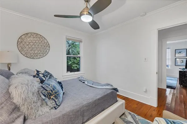 a view of a bedroom with furniture and a window