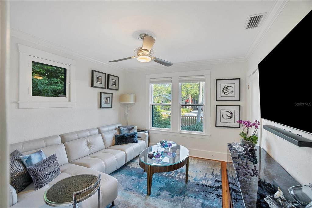 1716 Oak Street Sarasota, FL 34236 - Photo 18 of 49 a living room with furniture a window and a flat screen tv