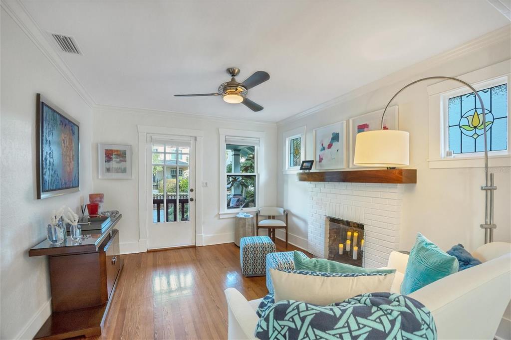 1716 Oak Street Sarasota, FL 34236 - Photo 2 of 49 a living room with furniture and a fireplace