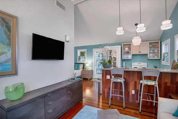 a living room with fireplace furniture and a flat screen tv