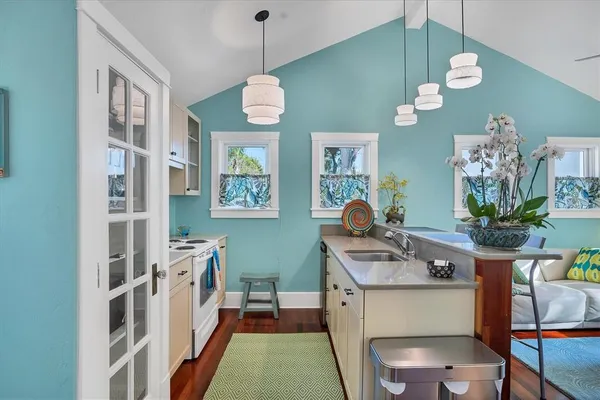 a kitchen with cabinets and window