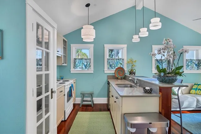 a kitchen with cabinets and window