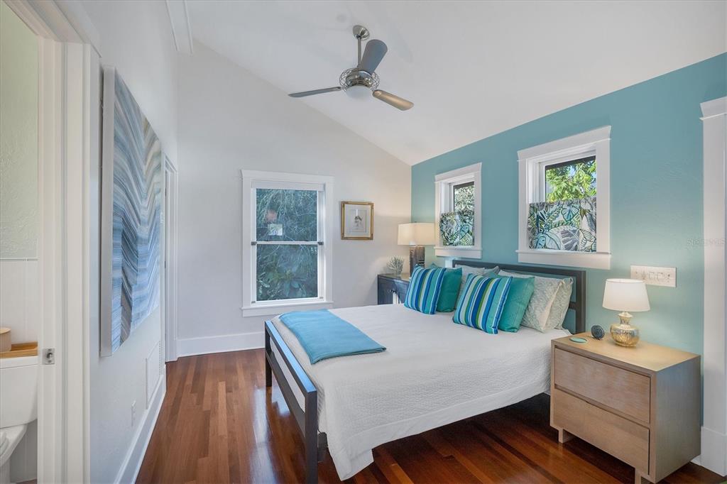 1716 Oak Street Sarasota, FL 34236 - Photo 26 of 49 a bedroom with a bed and wooden floor