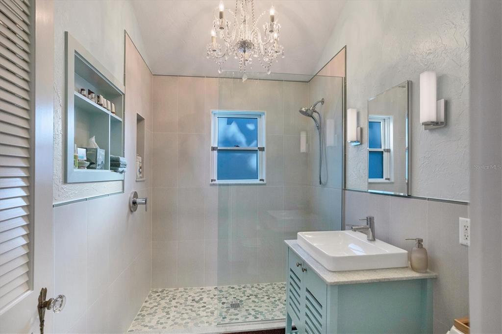 1716 Oak Street Sarasota, FL 34236 - Photo 28 of 49 a bathroom with a sink a mirror and a toilet