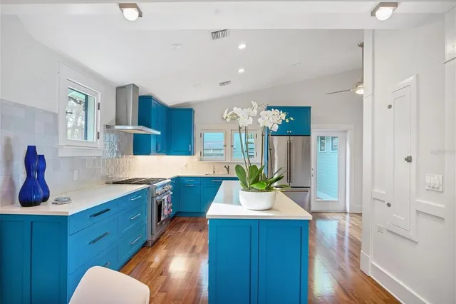 a room with wooden floors and wooden cabinets