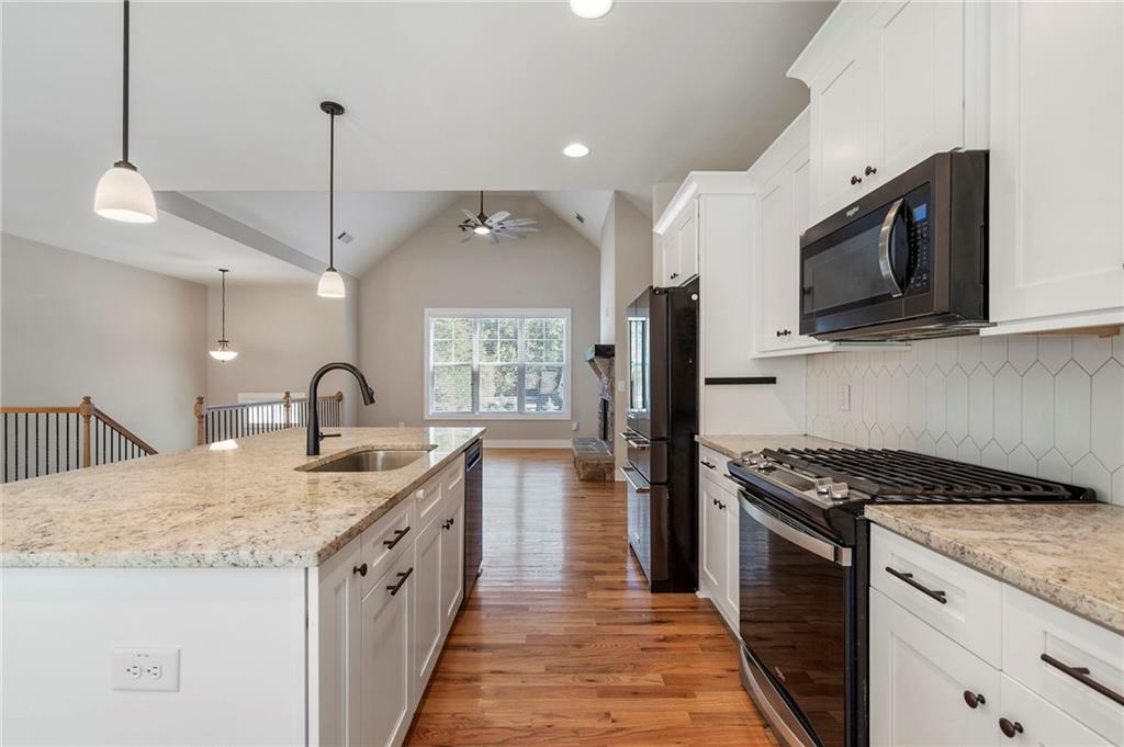 17 Pinoak Trail Cartersville, GA 30121 - Photo 18 of 37 a kitchen with granite countertop a sink and steel appliances