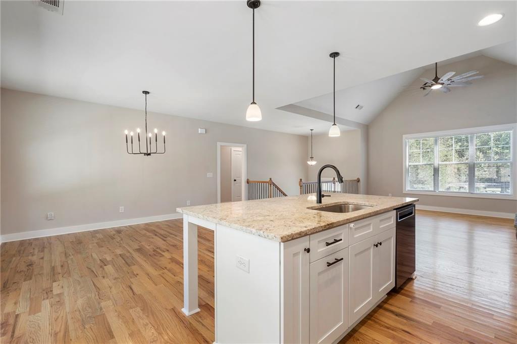 17 Pinoak Trail Cartersville, GA 30121 - Photo 19 of 37 a view of a kitchen counter space a sink wooden floor and a window