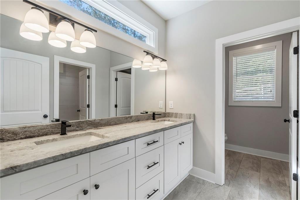 17 Pinoak Trail Cartersville, GA 30121 - Photo 22 of 37 a bathroom with a granite countertop sink double and mirror