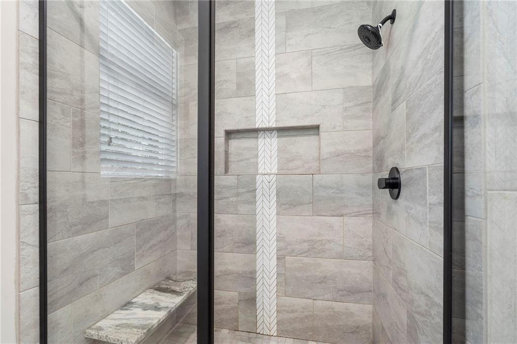 17 Pinoak Trail Cartersville, GA 30121 - Photo 23 of 37 a bathroom with a glass shower door