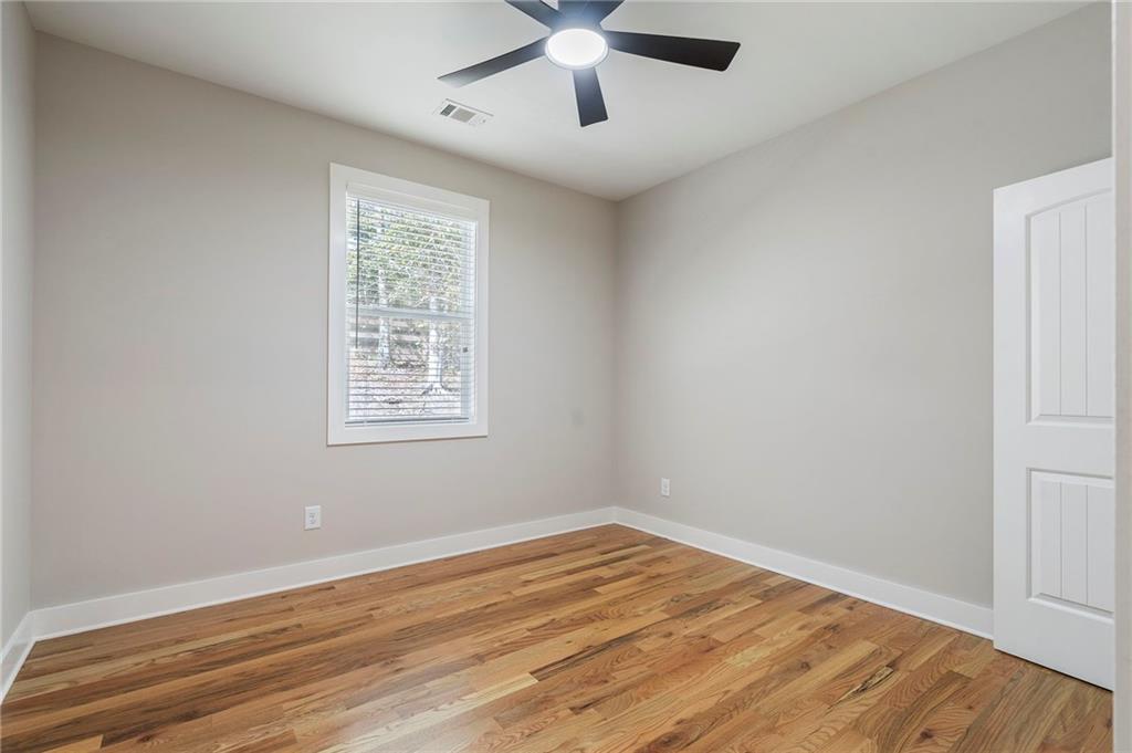 17 Pinoak Trail Cartersville, GA 30121 - Photo 24 of 37 a view of empty room with wooden floor and fan