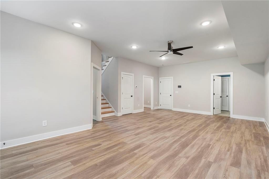 17 Pinoak Trail Cartersville, GA 30121 - Photo 30 of 37 a view of an empty room with wooden floor and a ceiling fan