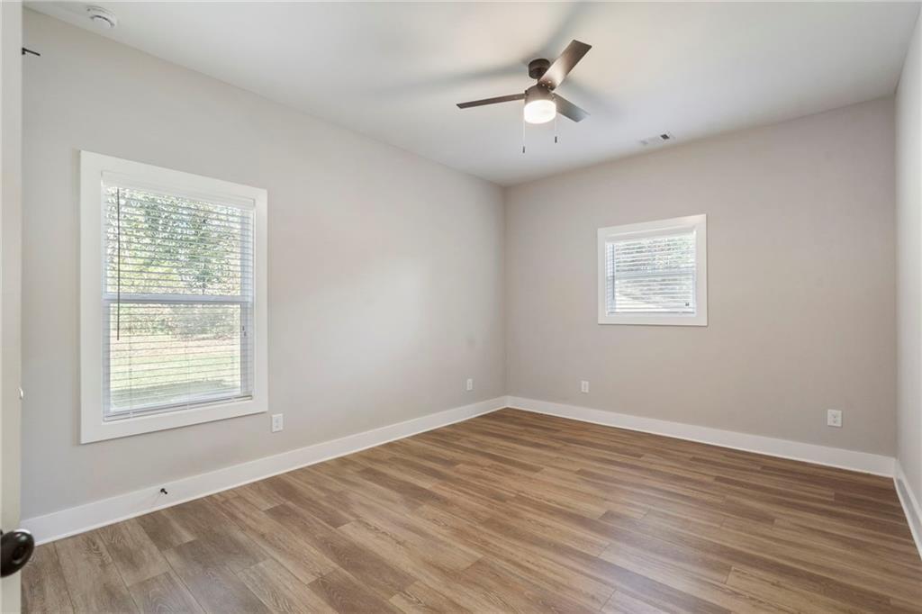 17 Pinoak Trail Cartersville, GA 30121 - Photo 34 of 37 a view of an empty room with wooden floor and a window