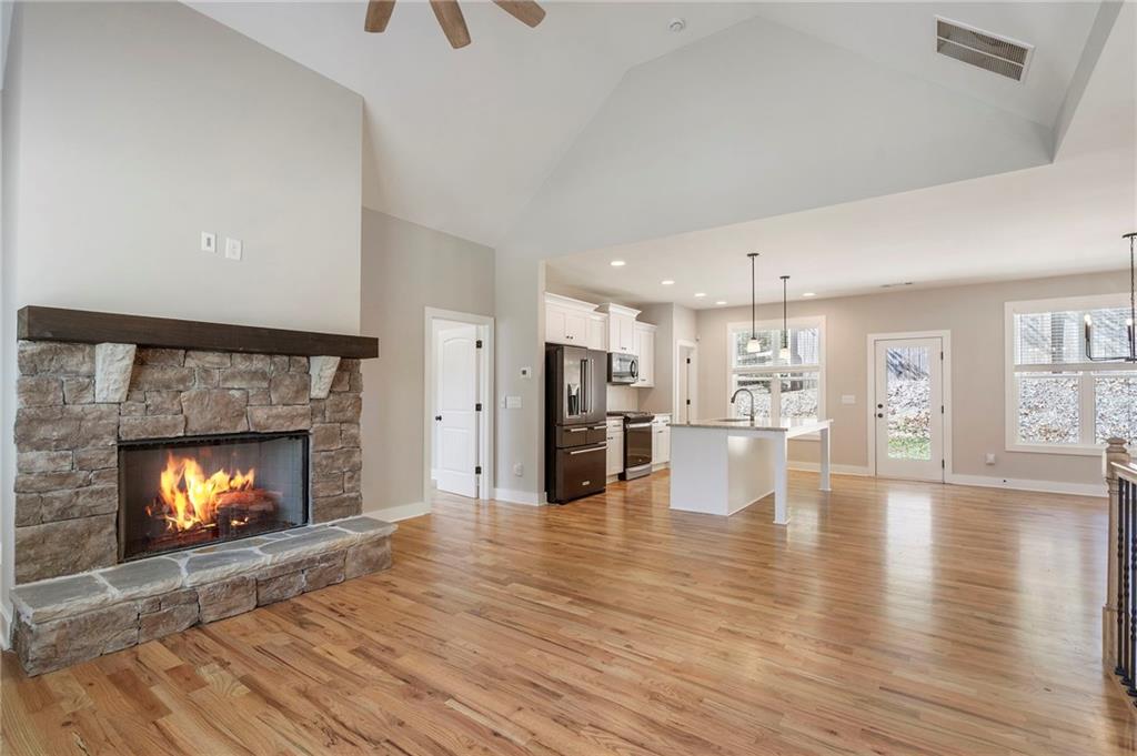 17 Pinoak Trail Cartersville, GA 30121 - Photo 6 of 37 a view of a livingroom with wooden floor and a fireplace
