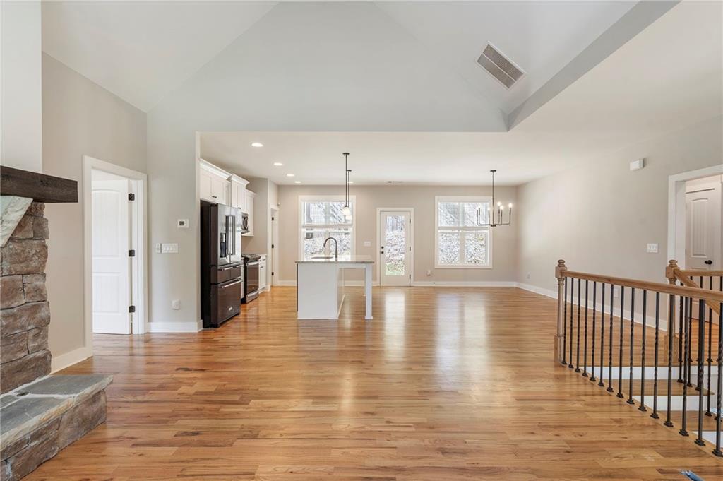 17 Pinoak Trail Cartersville, GA 30121 - Photo 7 of 37 a view of empty room with wooden floor and windows