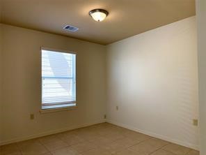 10064 Emnora Lane Houston, TX 77080 - Photo 12 of 31 an empty room with a window